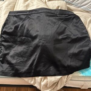 Black satin skirt with pockets